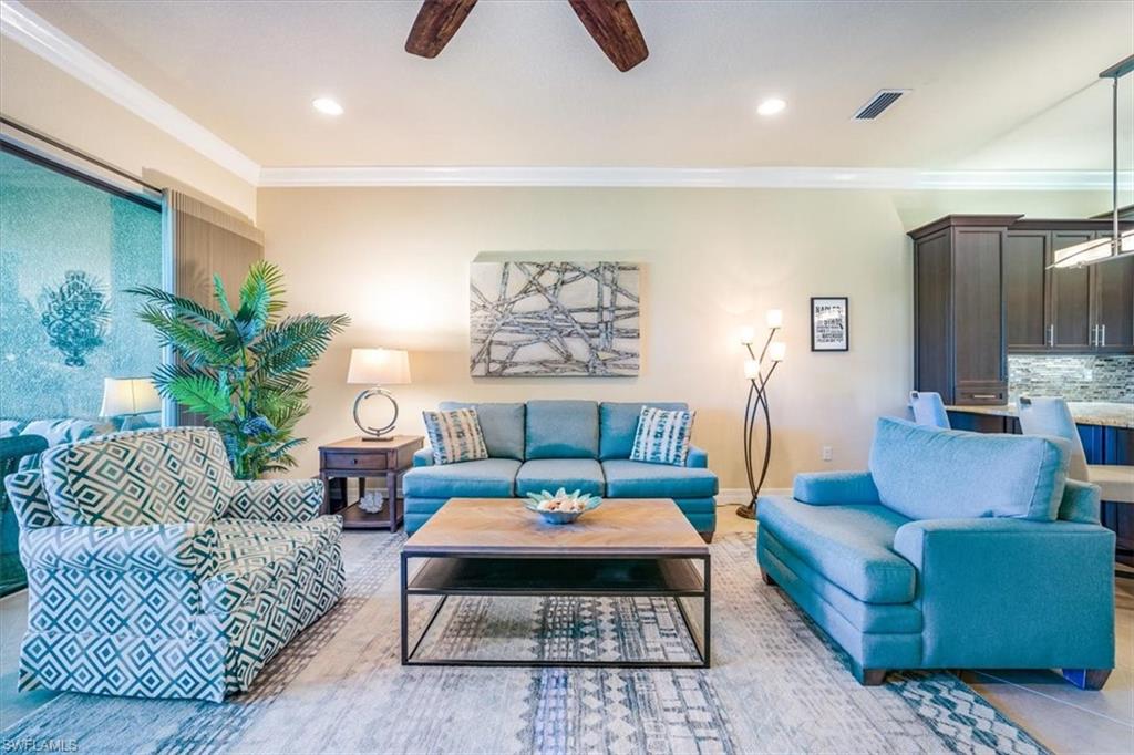 13474 Sumter Lane Naples, FL 34109 - Photo 10 of 25 a living room with furniture rug and window