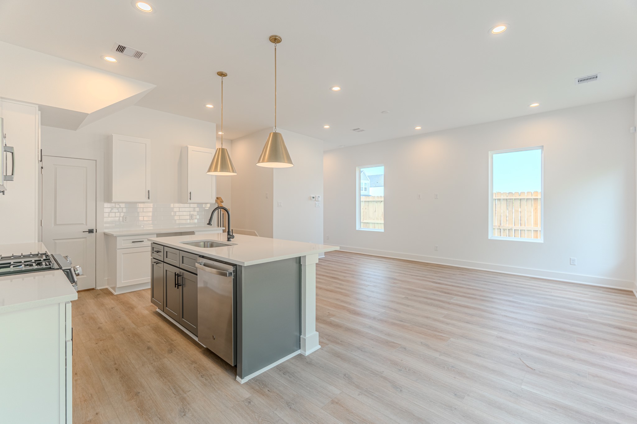 7628 Inwood Hls Lane Houston, TX 77088 - Photo 14 of 46 a kitchen with a stove and a sink