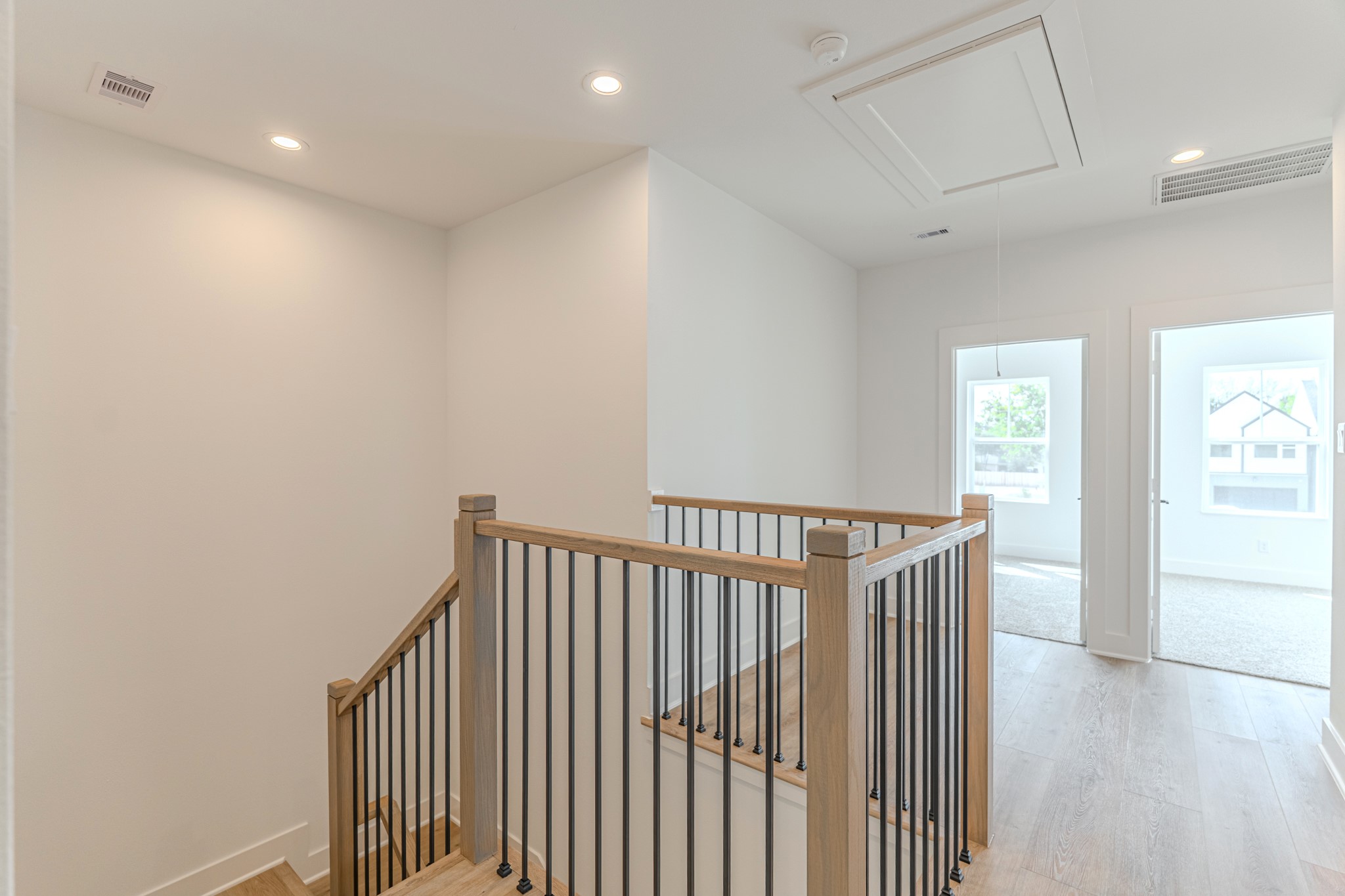 7628 Inwood Hls Lane Houston, TX 77088 - Photo 17 of 46 a view of hallway with wooden floor