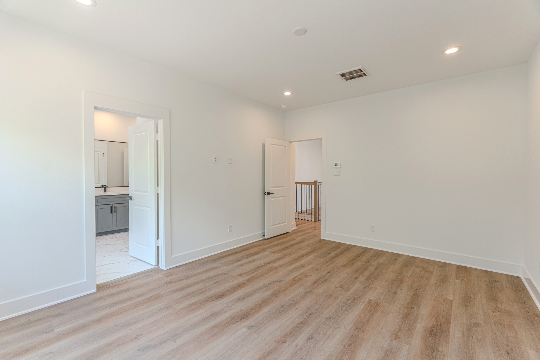 7628 Inwood Hls Lane Houston, TX 77088 - Photo 19 of 46 a view of empty room with wooden floor