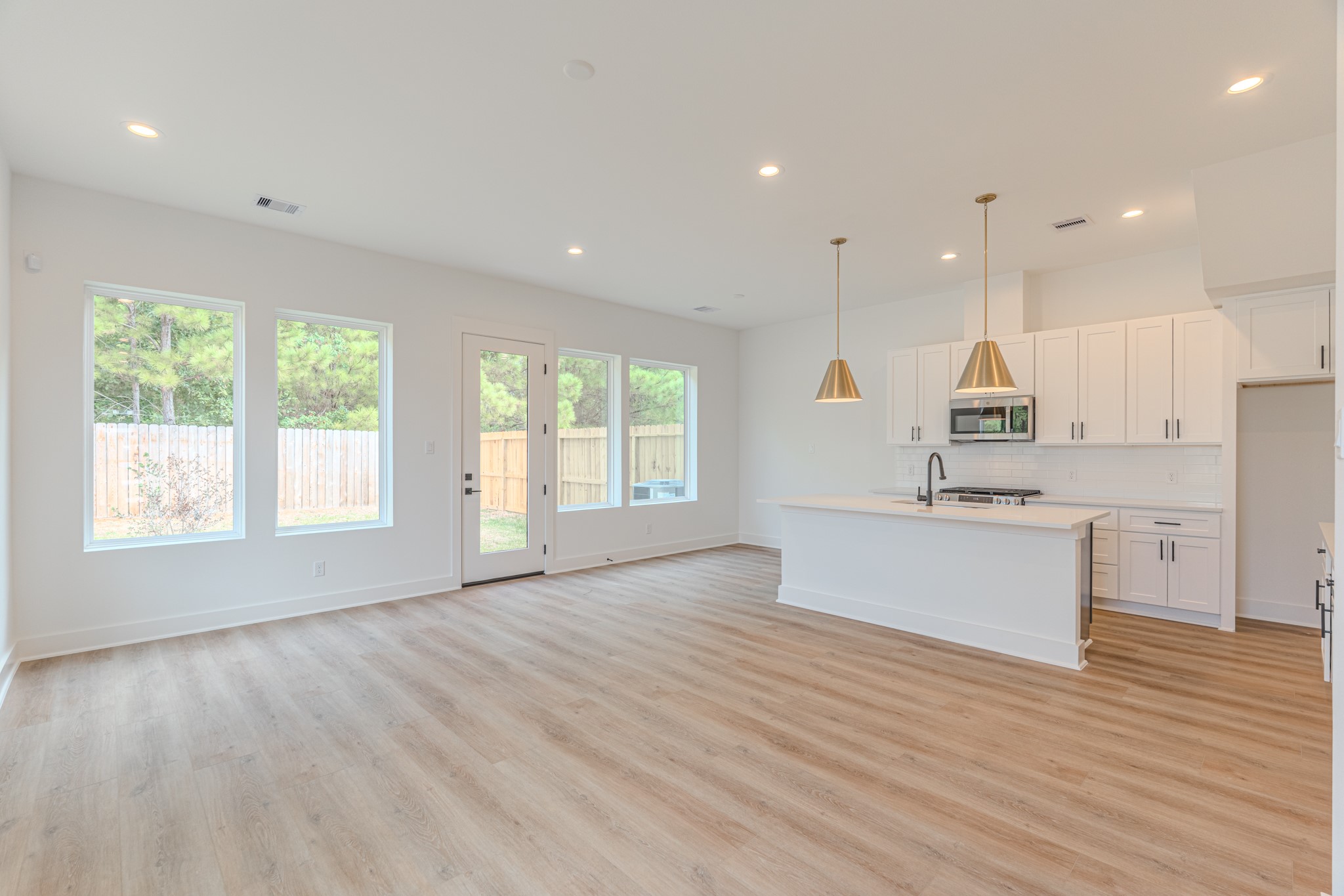 7628 Inwood Hls Lane Houston, TX 77088 - Photo 3 of 46 a view of kitchen with kitchen island wooden floors appliances and cabinets
