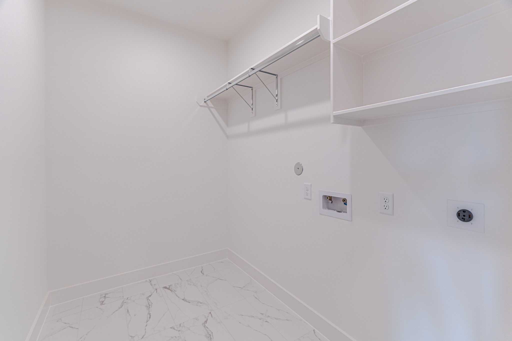 7628 Inwood Hls Lane Houston, TX 77088 - Photo 31 of 46 a view of small space with racks on the wall