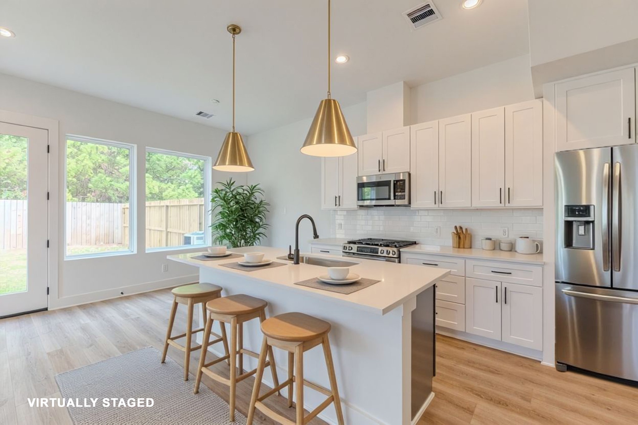 7628 Inwood Hls Lane Houston, TX 77088 - Photo 36 of 46 a kitchen with stainless steel appliances granite countertop a sink a stove a refrigerator cabinets and a dining table