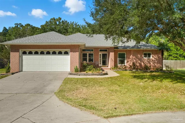 a view of a house with swimming pool and sitting area
