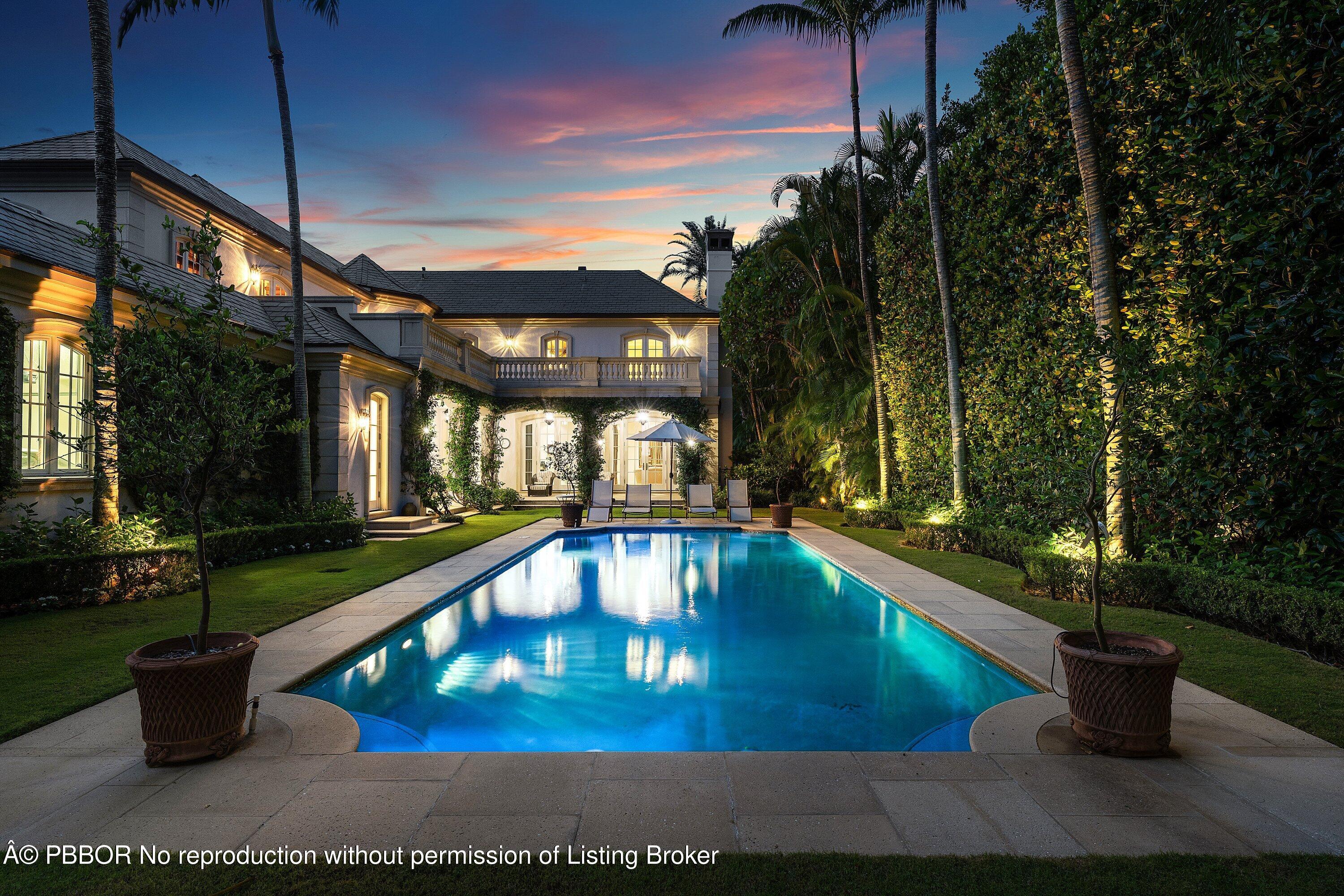 242 Wells Road Palm Beach, FL 33480 - Photo 50 of 54 a view of a swimming pool with a patio