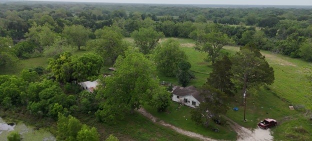 2627 FM 524 Road Sweeny, TX 77480 - Photo 8 of 9 an aerial view of residential houses with outdoor space and trees