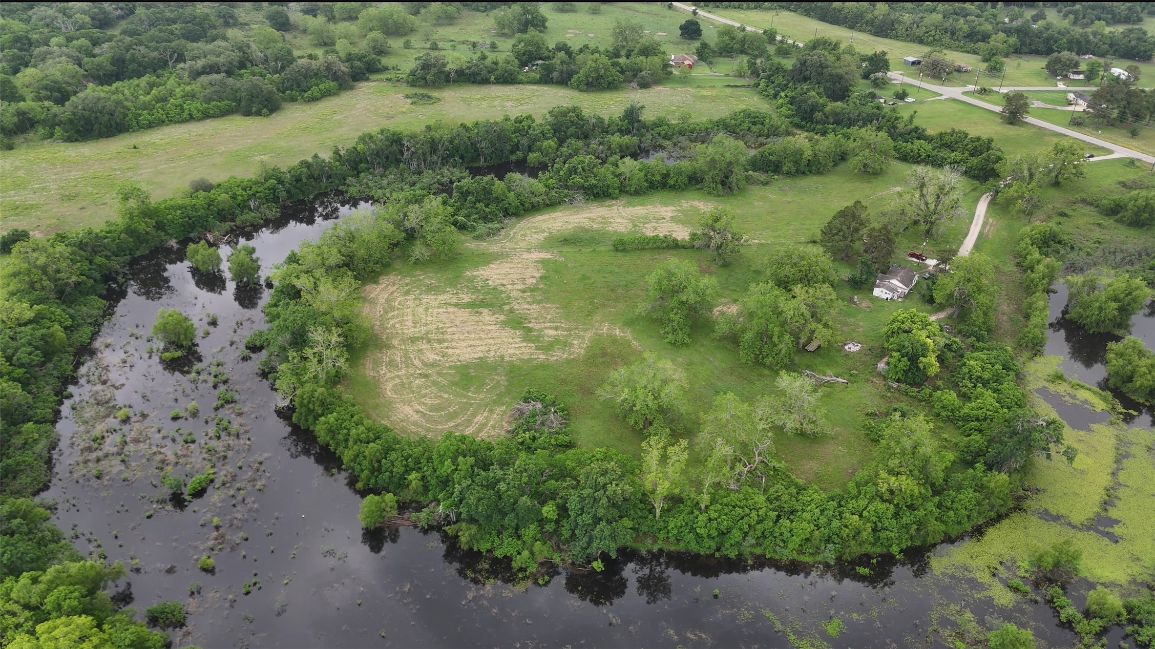 2627 FM 524 Road Sweeny, TX 77480 - Photo 9 of 9 a view of a lush green forest with lots of trees