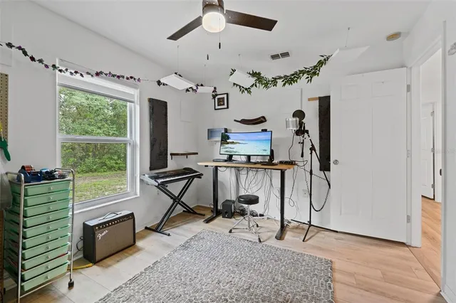 a view of a livingroom with furniture and a window