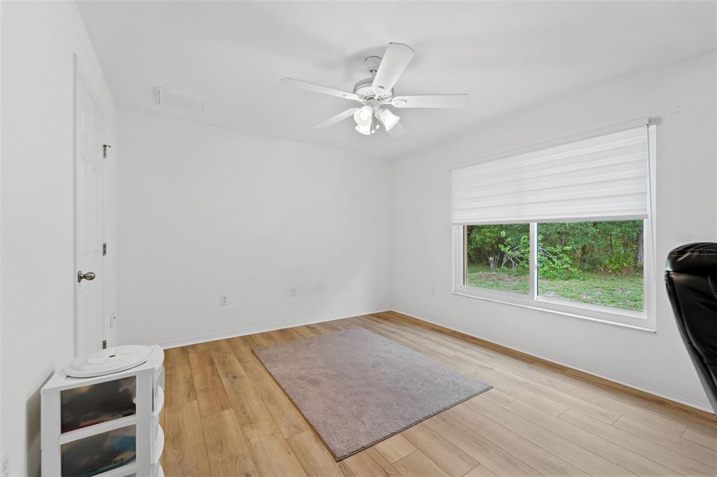 199 Linder Drive Homosassa, FL 34446 - Photo 13 of 29 a view of a livingroom with a ceiling fan and a window