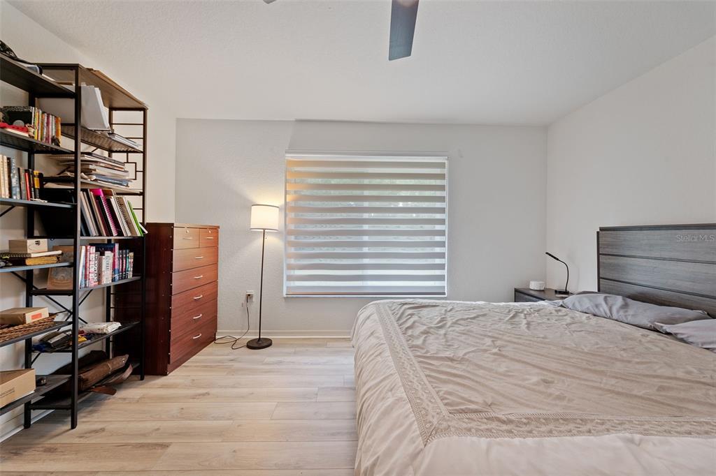 199 Linder Drive Homosassa, FL 34446 - Photo 17 of 29 a bedroom with a bed and a book shelf