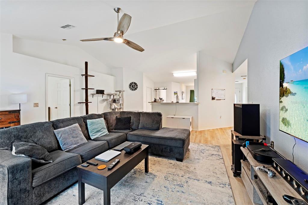 199 Linder Drive Homosassa, FL 34446 - Photo 26 of 29 a living room with furniture and a flat screen tv