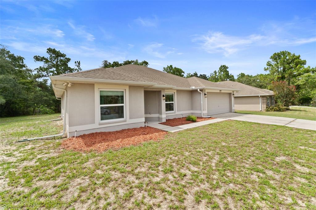 199 Linder Drive Homosassa, FL 34446 - Photo 29 of 29 a view of a house with a backyard