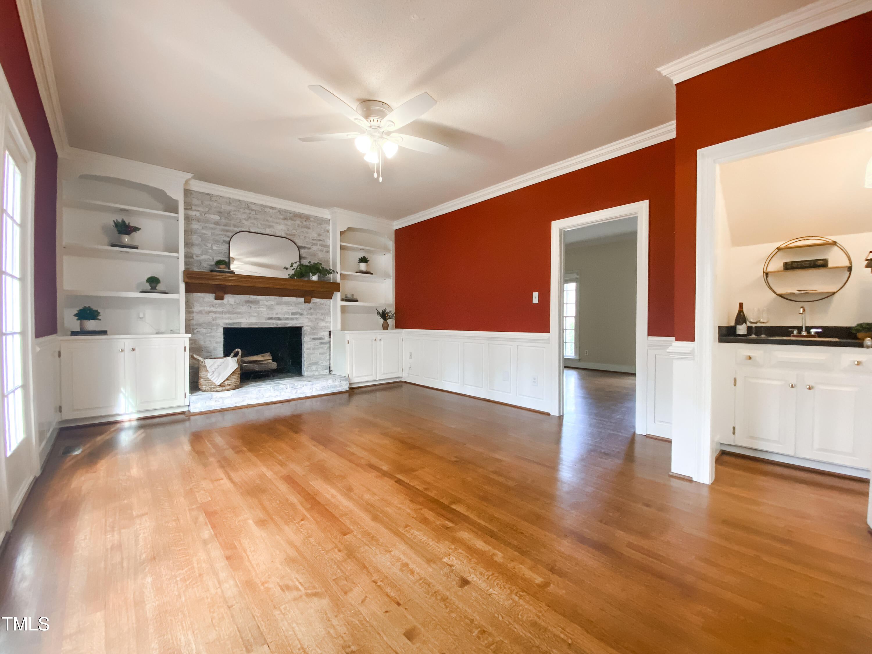 7905 Farnham Court Raleigh, NC 27615 - Photo 11 of 28 a living room with furniture and a fireplace
