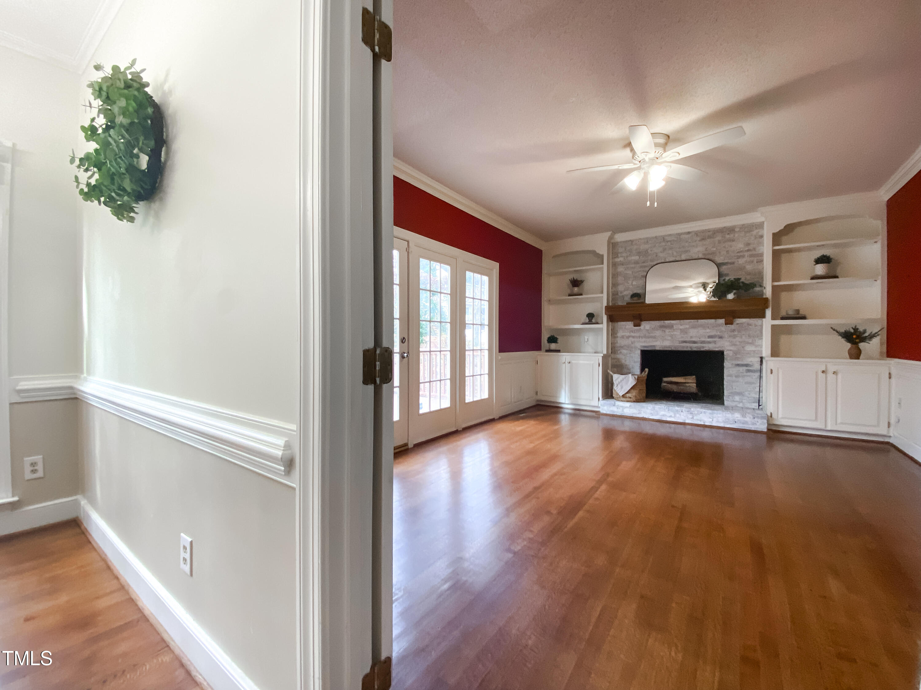 7905 Farnham Court Raleigh, NC 27615 - Photo 14 of 28 wooden floor in an empty room with a fireplace