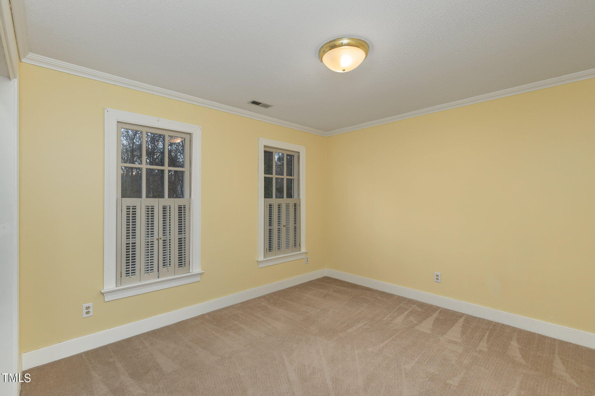 7905 Farnham Court Raleigh, NC 27615 - Photo 22 of 28 an empty room with windows