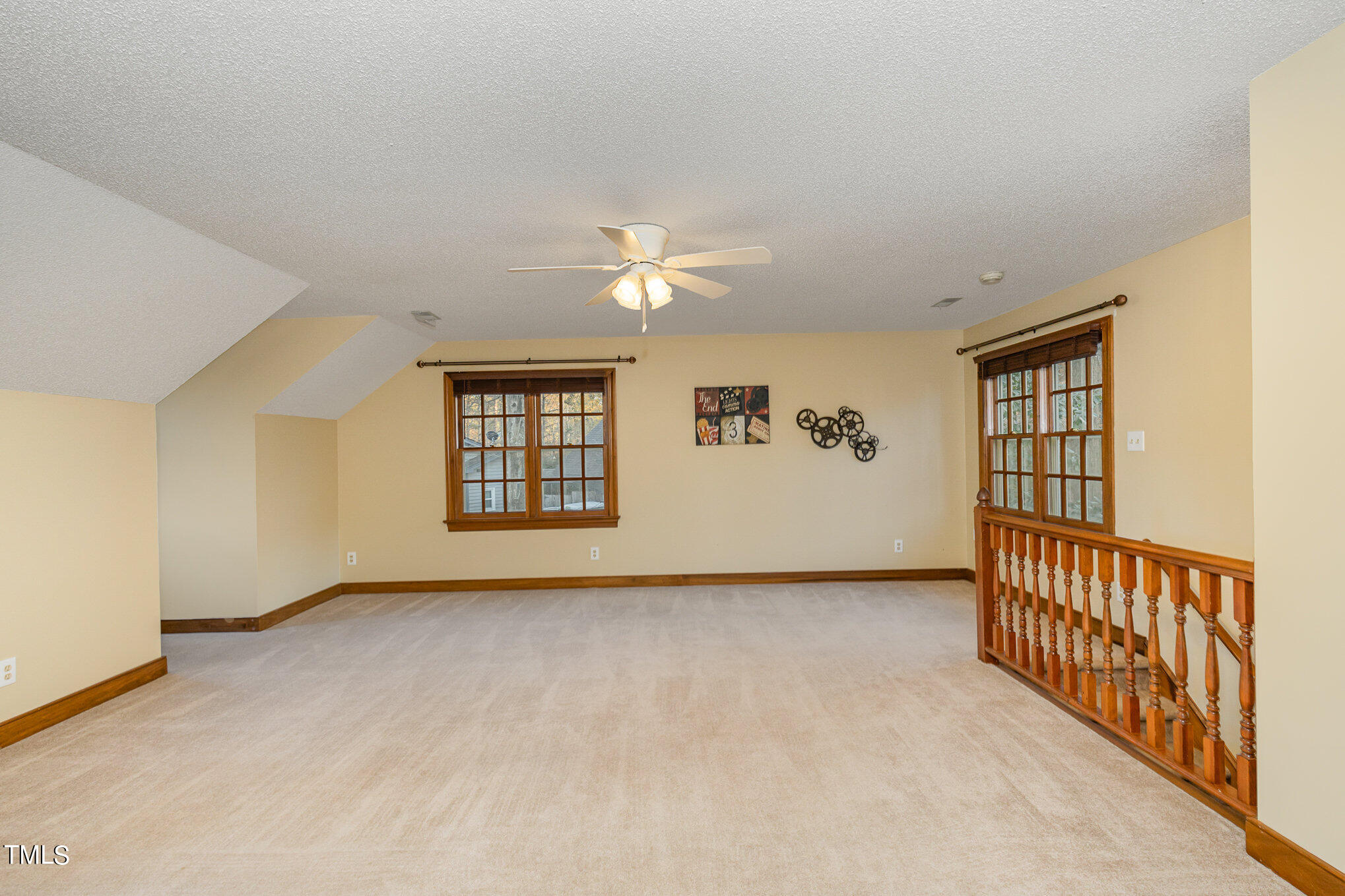 7905 Farnham Court Raleigh, NC 27615 - Photo 25 of 28 a view of an empty room with window and a ceiling fan