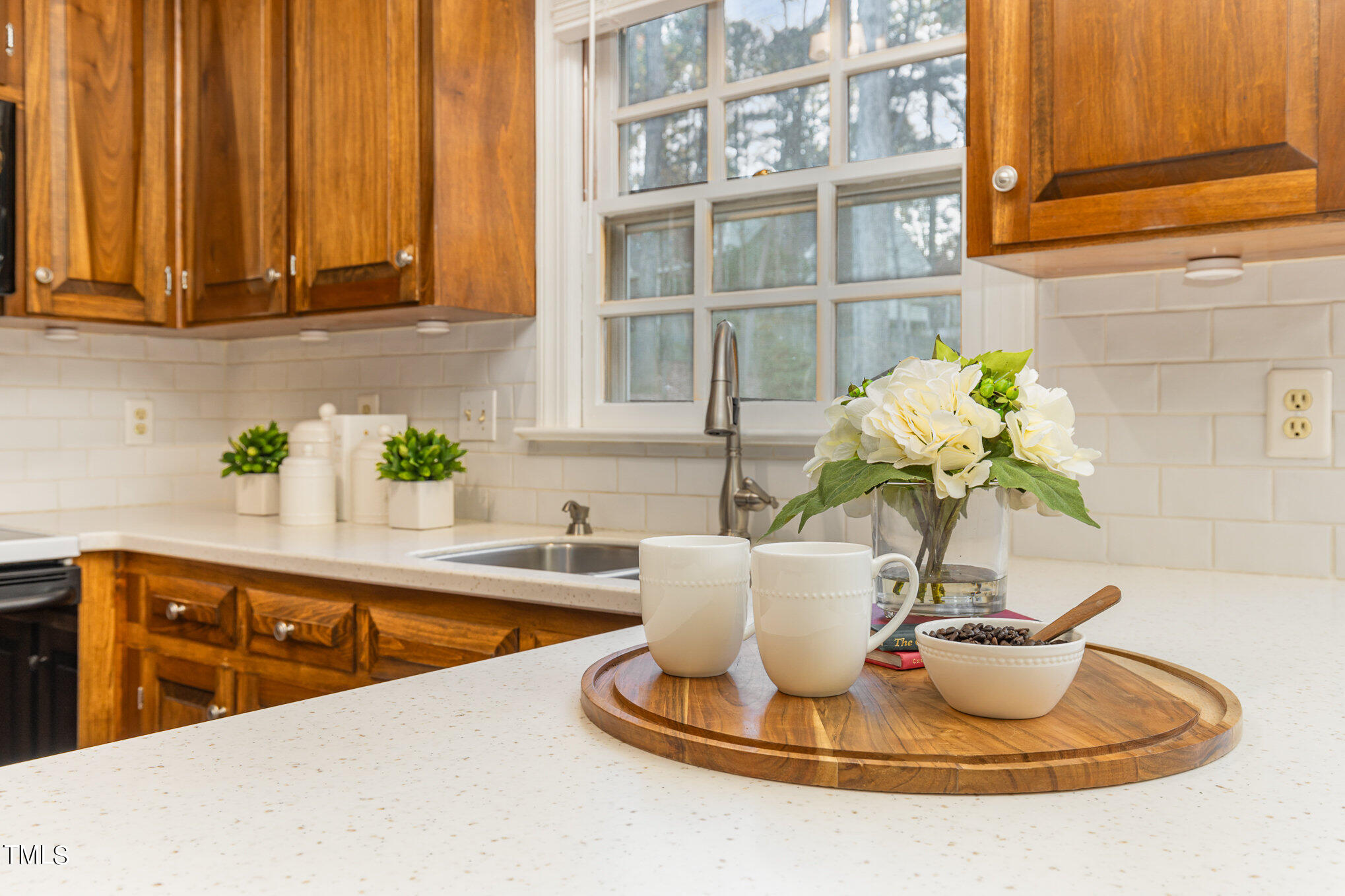 7905 Farnham Court Raleigh, NC 27615 - Photo 10 of 28 a kitchen with a sink and a window