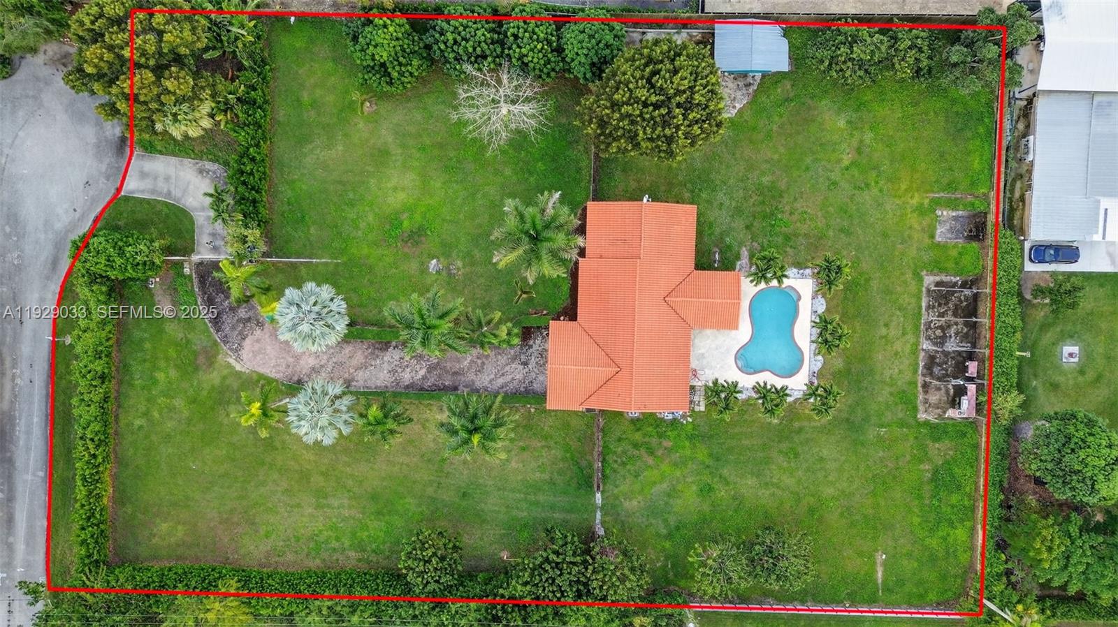 an aerial view of a house with a yard