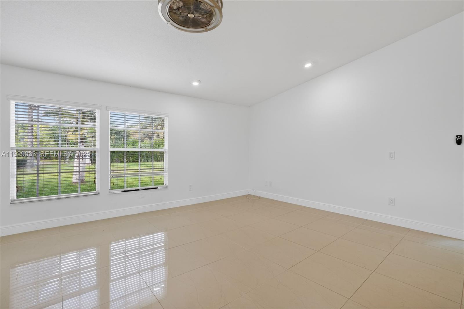 21080 Southwest 242nd Street Homestead, FL 33031 - Photo 21 of 37 a view of an empty room with a window