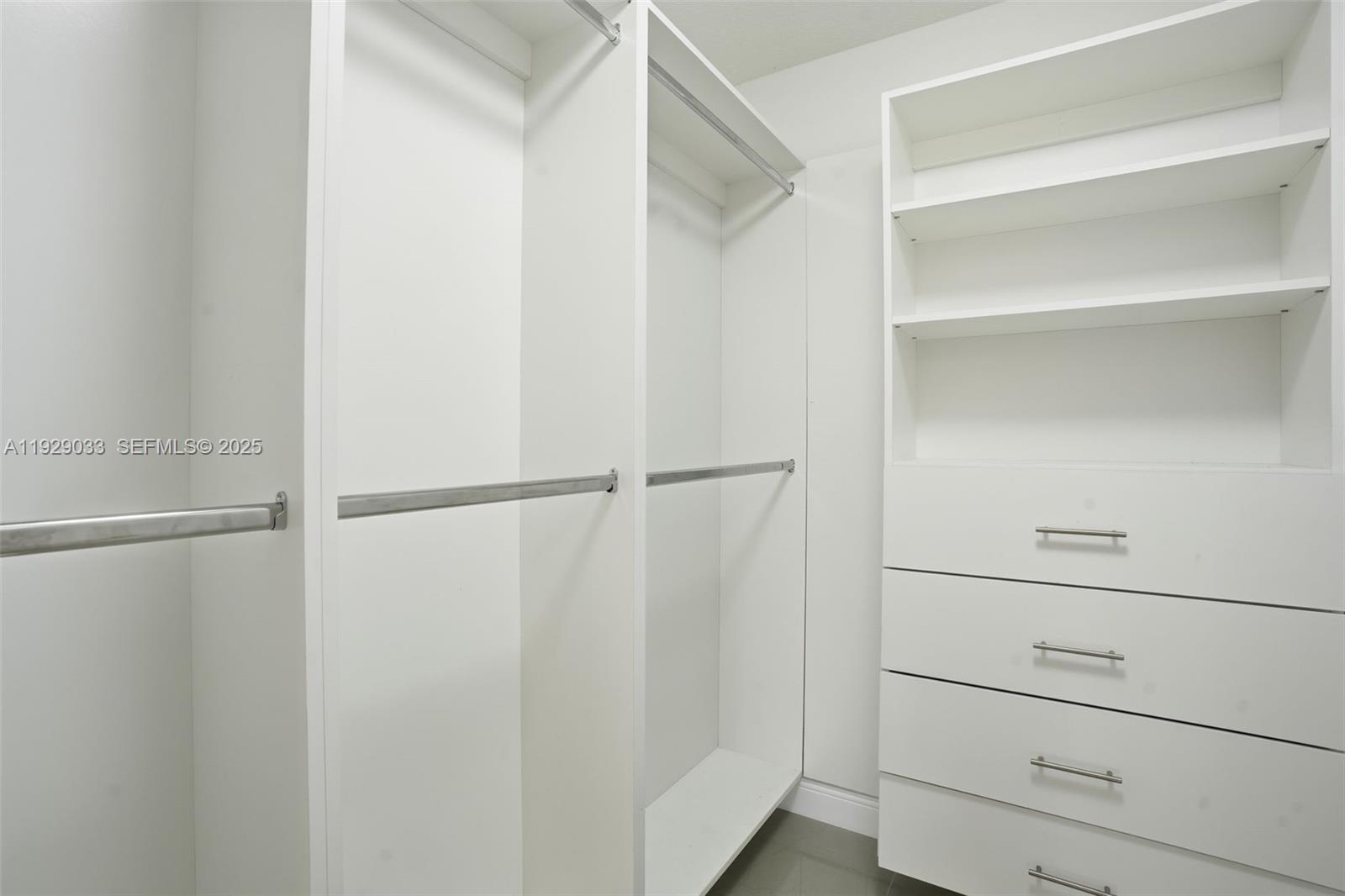21080 Southwest 242nd Street Homestead, FL 33031 - Photo 24 of 37 a view of an empty walk in closet