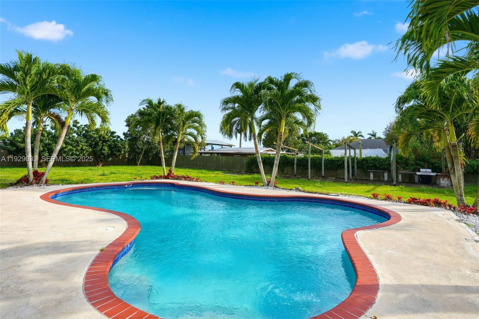 21080 Southwest 242nd Street Homestead, FL 33031 - Photo 30 of 37 a view of swimming pool with small yard