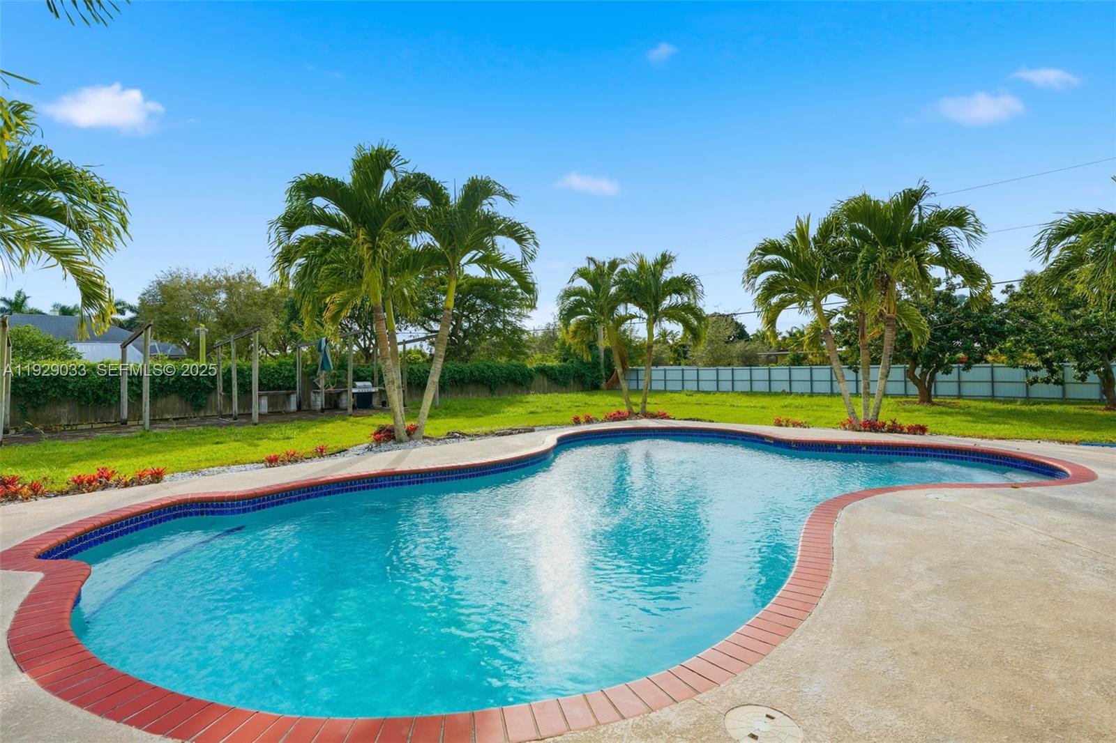 21080 Southwest 242nd Street Homestead, FL 33031 - Photo 31 of 37 a view of swimming pool with a yard