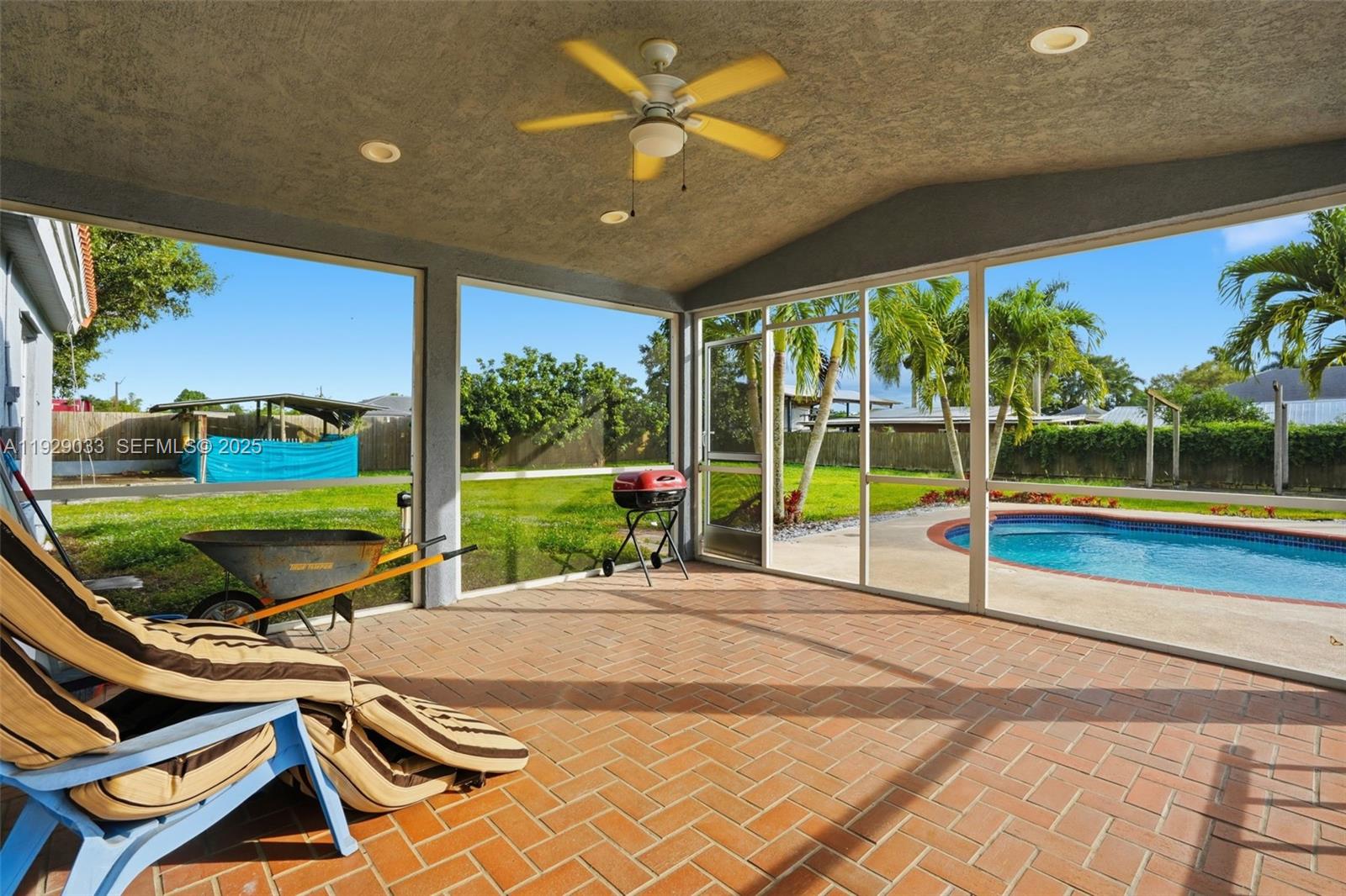 21080 Southwest 242nd Street Homestead, FL 33031 - Photo 32 of 37 a view of a patio with a backyard