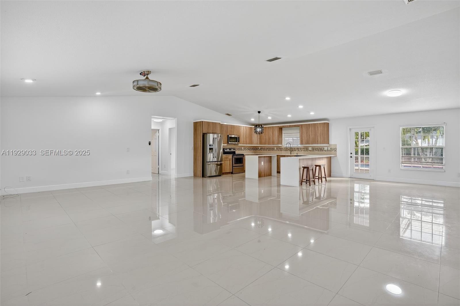 21080 Southwest 242nd Street Homestead, FL 33031 - Photo 8 of 37 a view of dining room with furniture and wooden floor