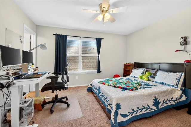 a bedroom with a bed and a table