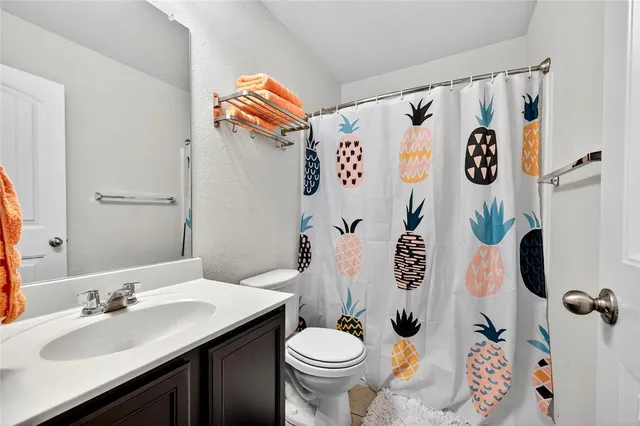 a bathroom with a sink and toilet
