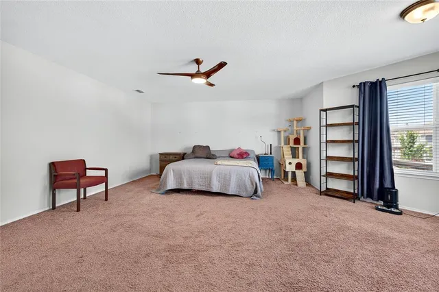 a bedroom with a bed closet and a window
