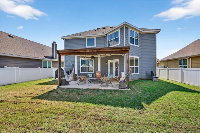 a front view of a house with garden and porch