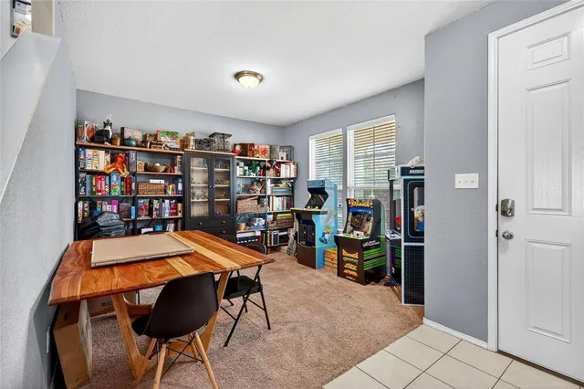 a room with lots of furniture and white walls