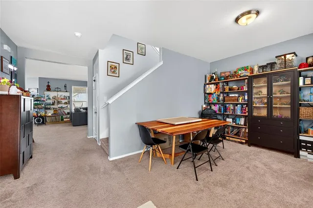 a room with furniture and gym equipment