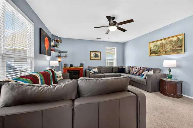 a living room with furniture and a window