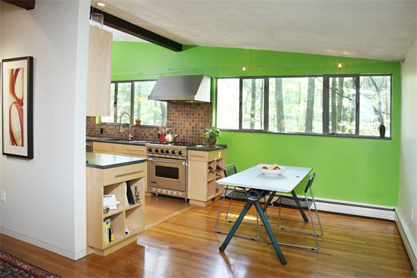 11 Dewey Road Lexington, MA 02420 - Photo 4 of 9 a kitchen with a table chairs a sink dishwasher stove and cabinets with wooden floor