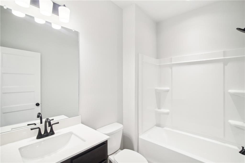 163 Wingate Drive Winder, GA 30680 - Photo 12 of 79 a bathroom with a sink toilet and shower