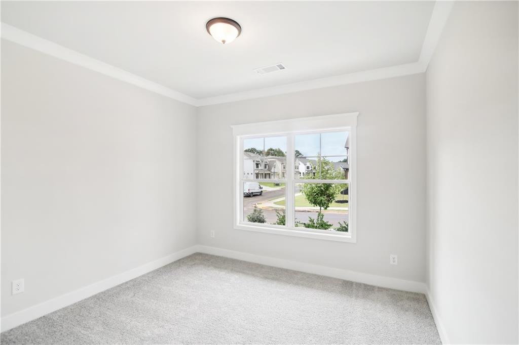 163 Wingate Drive Winder, GA 30680 - Photo 13 of 79 an empty room with windows