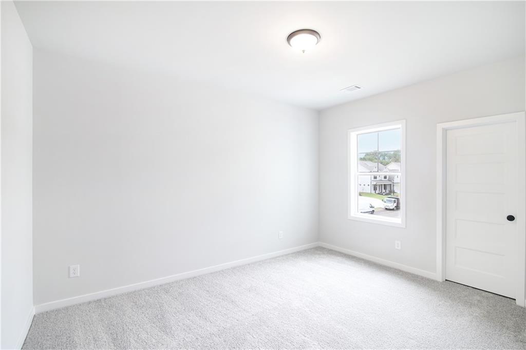 163 Wingate Drive Winder, GA 30680 - Photo 16 of 79 an empty room with windows