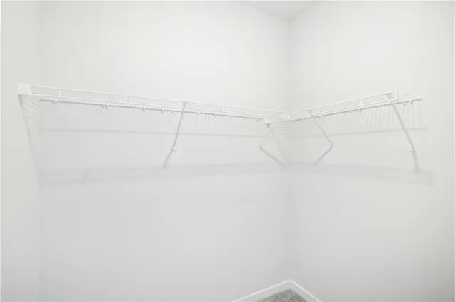 a bathroom with a double vanity sink a mirror and shower