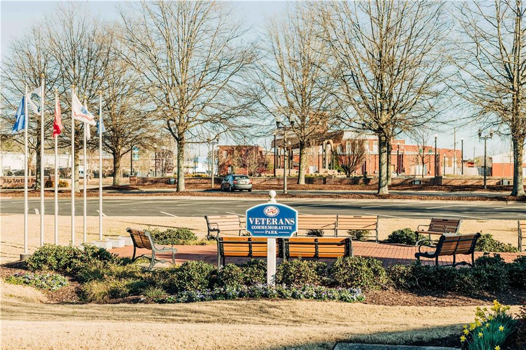 163 Wingate Drive Winder, GA 30680 - Photo 47 of 79 a park view with large trees and a bench