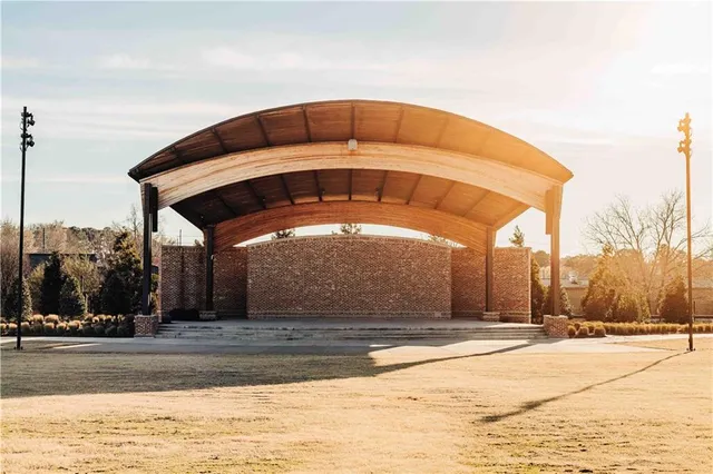 a view of a house with backyard and swimming pool