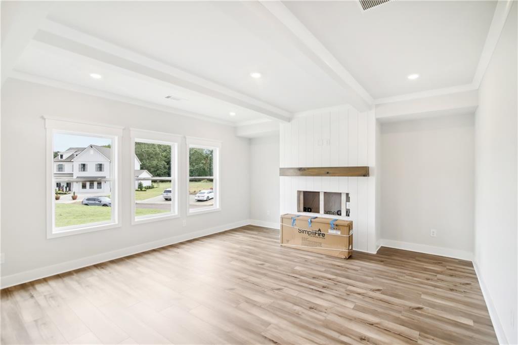 163 Wingate Drive Winder, GA 30680 - Photo 5 of 79 a living room with furniture and a fireplace