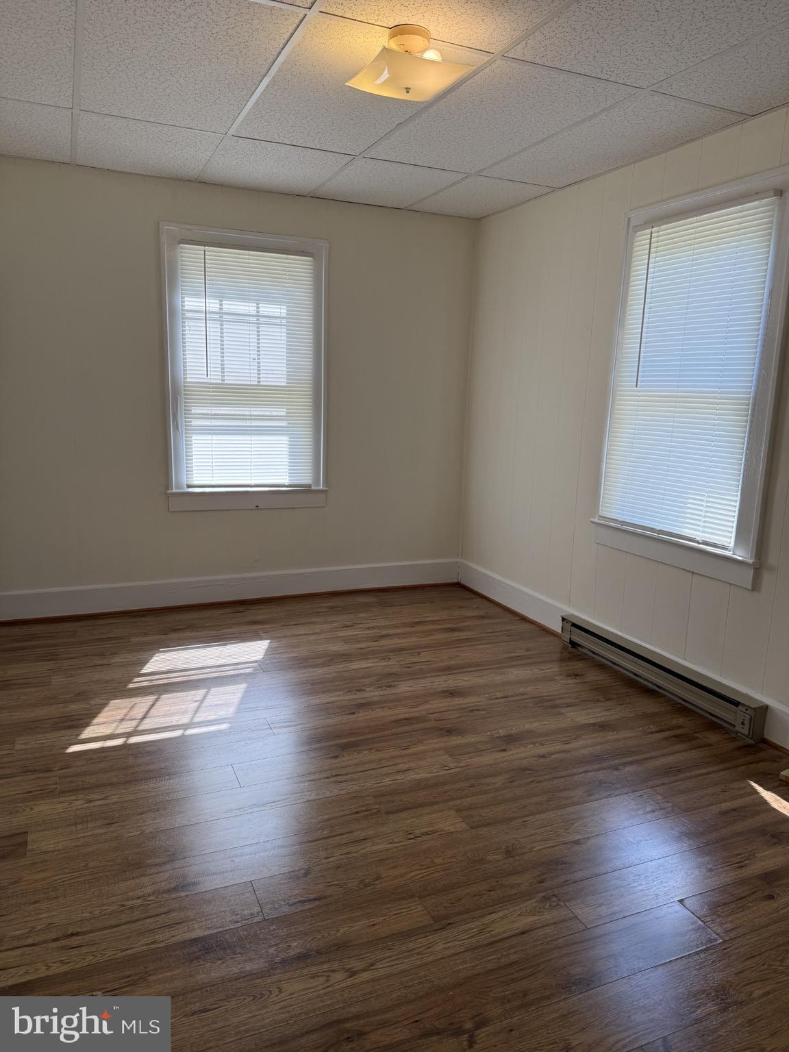 5497 Rosedale Drive King George, VA 22485 - Photo 12 of 12 an empty room with wooden floor and windows
