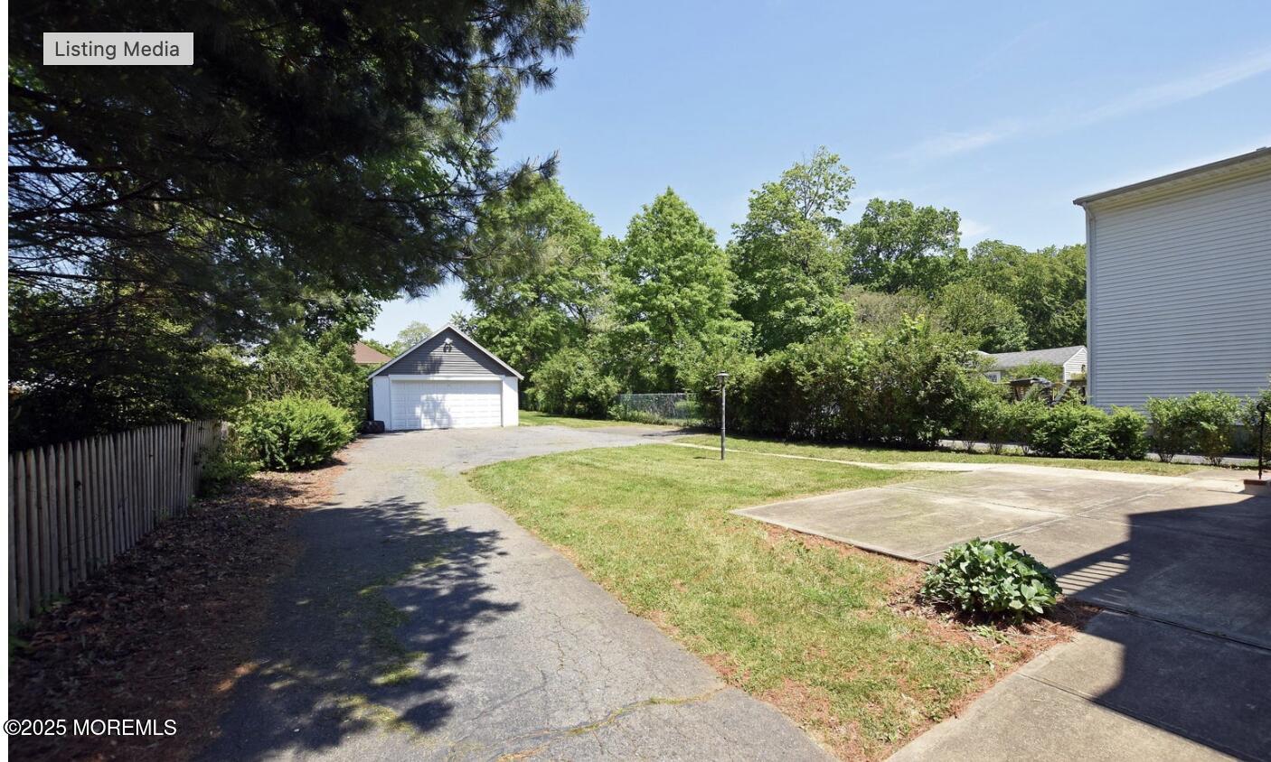 90 Pinckney Road, Unit B Red Bank, NJ 07701 - Photo 16 of 16 a front view of a house with yard and trees