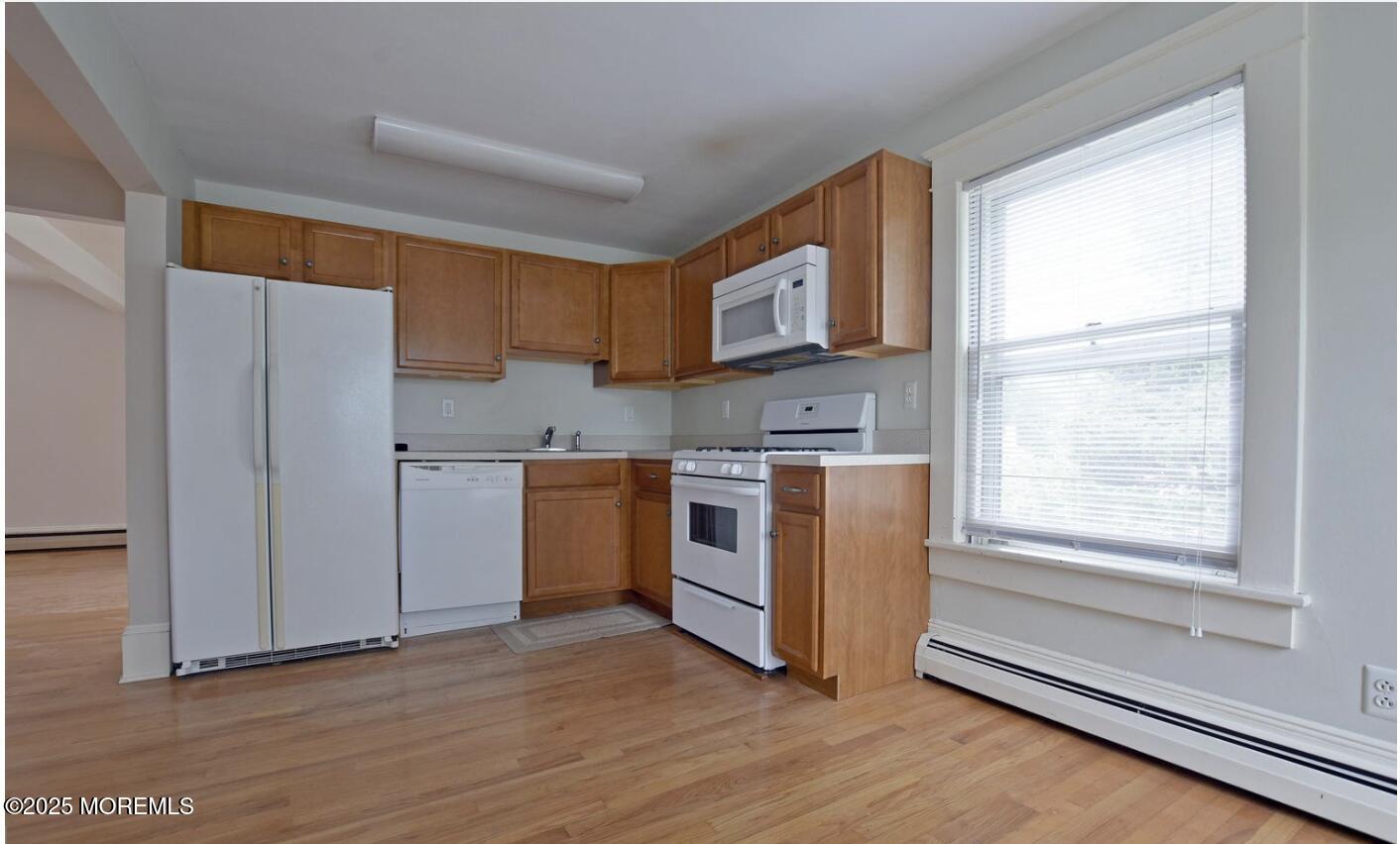 90 Pinckney Road, Unit B Red Bank, NJ 07701 - Photo 5 of 16 a view of kitchen with wooden floor and electronic appliances
