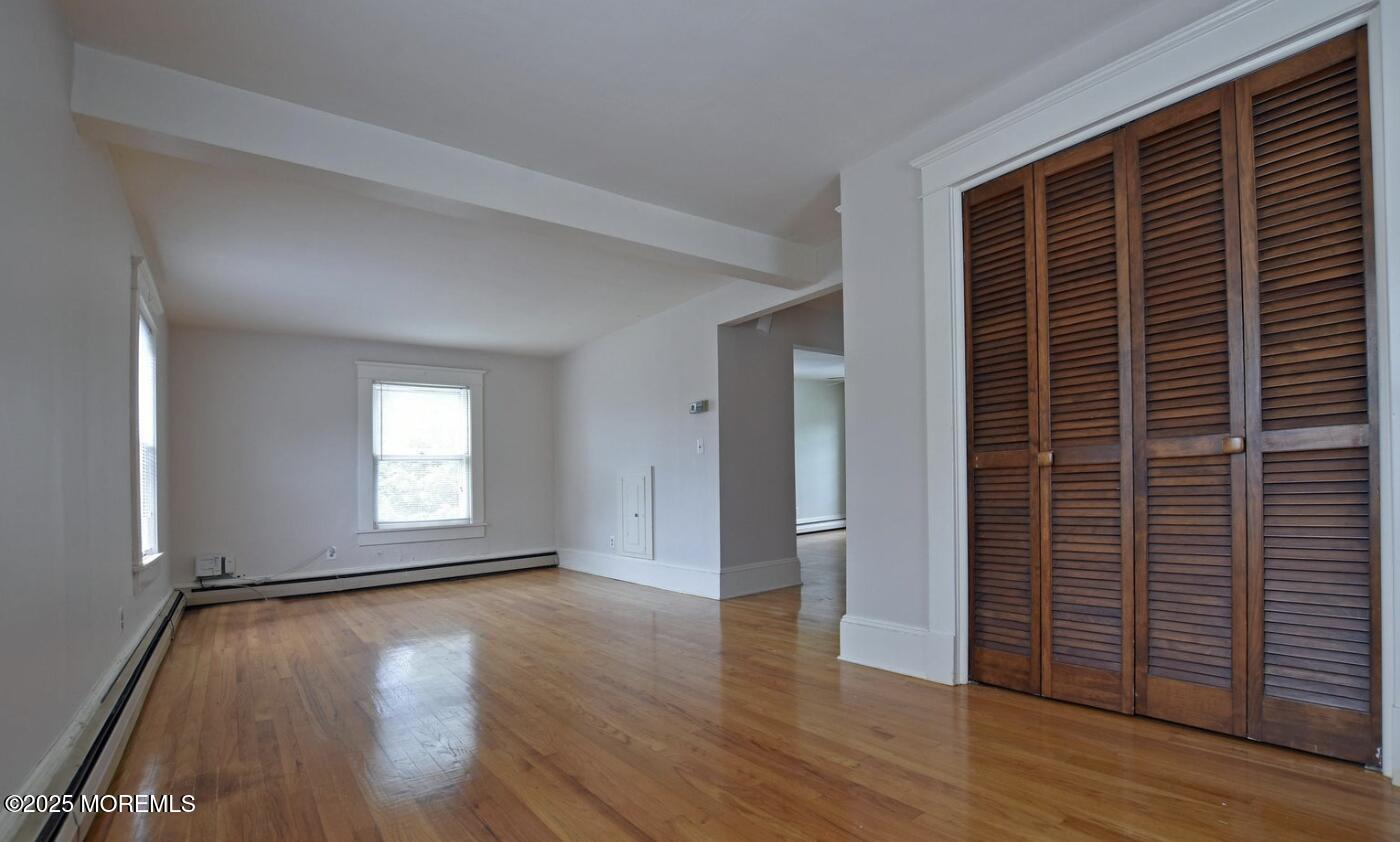 90 Pinckney Road, Unit B Red Bank, NJ 07701 - Photo 7 of 16 a view of empty room with wooden floor and fan