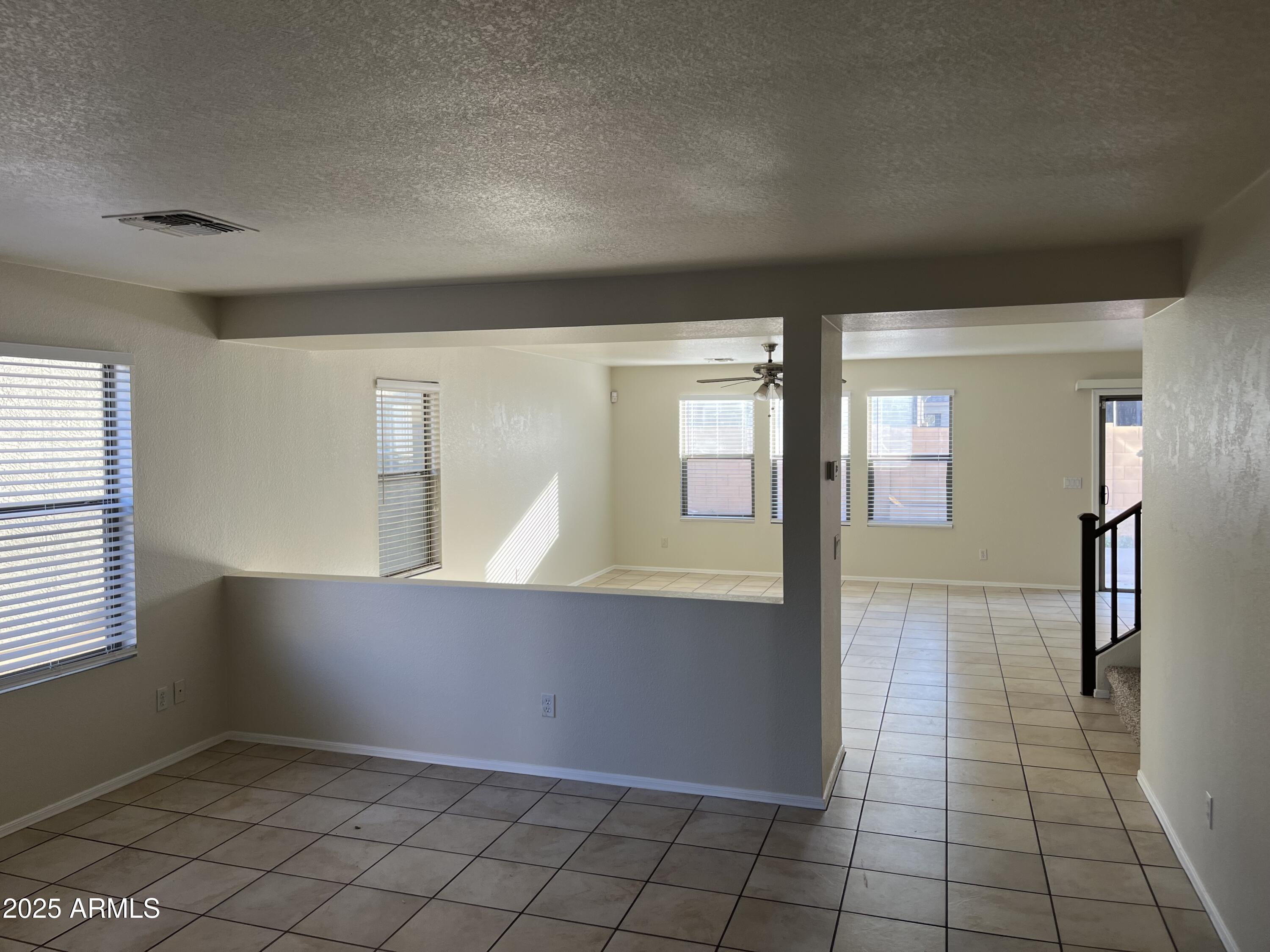 9441 West Jamestown Road Phoenix, AZ 85037 - Photo 3 of 12 a view of an empty room and window