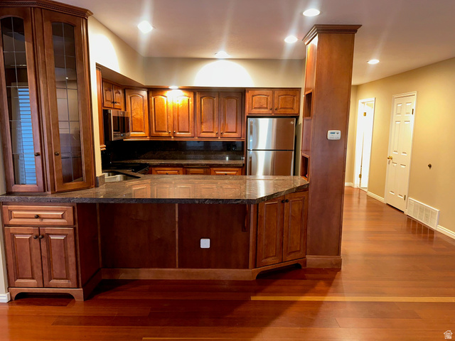 1715 Darling Street, Unit 3 Ogden, UT 84403 - Photo 4 of 26 Kitchen featuring wood cabinetry, dark countertops, recessed lighting, and stainless steel appliances