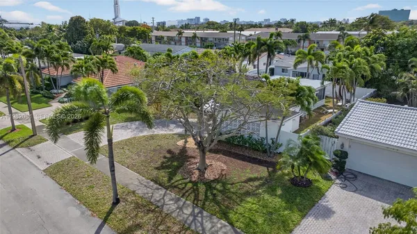 an aerial view of residential houses with outdoor space